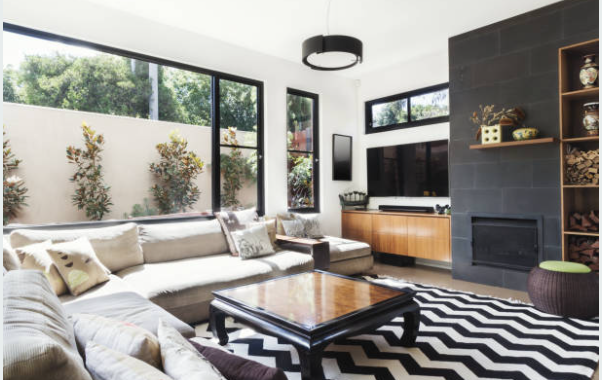 Black and white living room with colorful accents